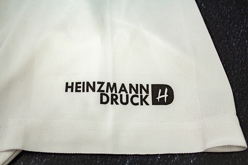 Heinzmann Druck Logo Sublimation auf weißem Polo Bruchsal Forst Karlsruhe